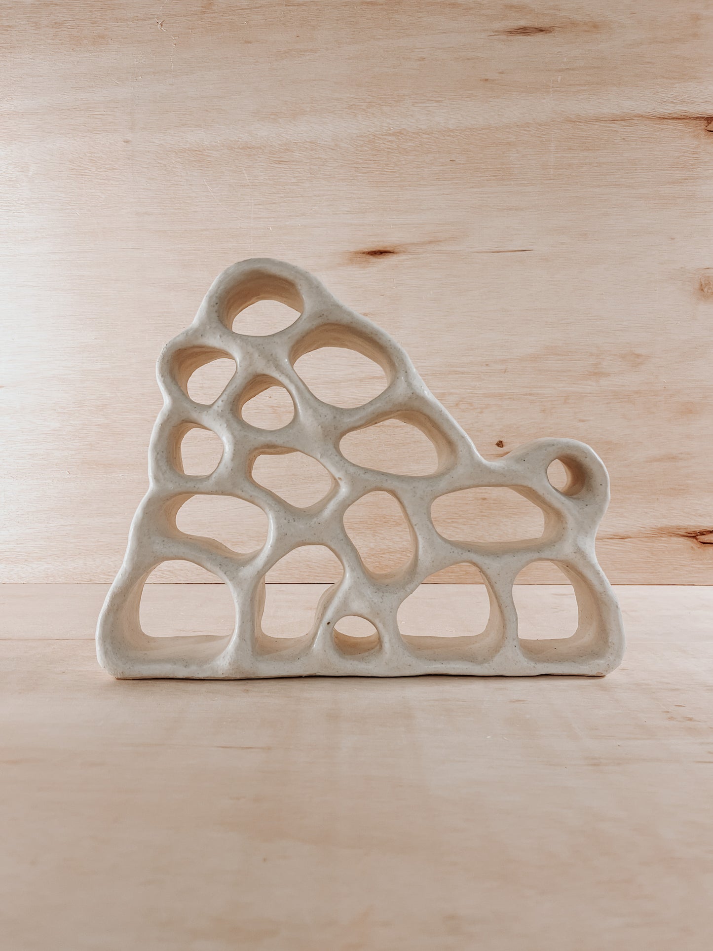 Hand-built ceramic altar with matte glaze, wall-mounted, soft curves, handmade in Boulder