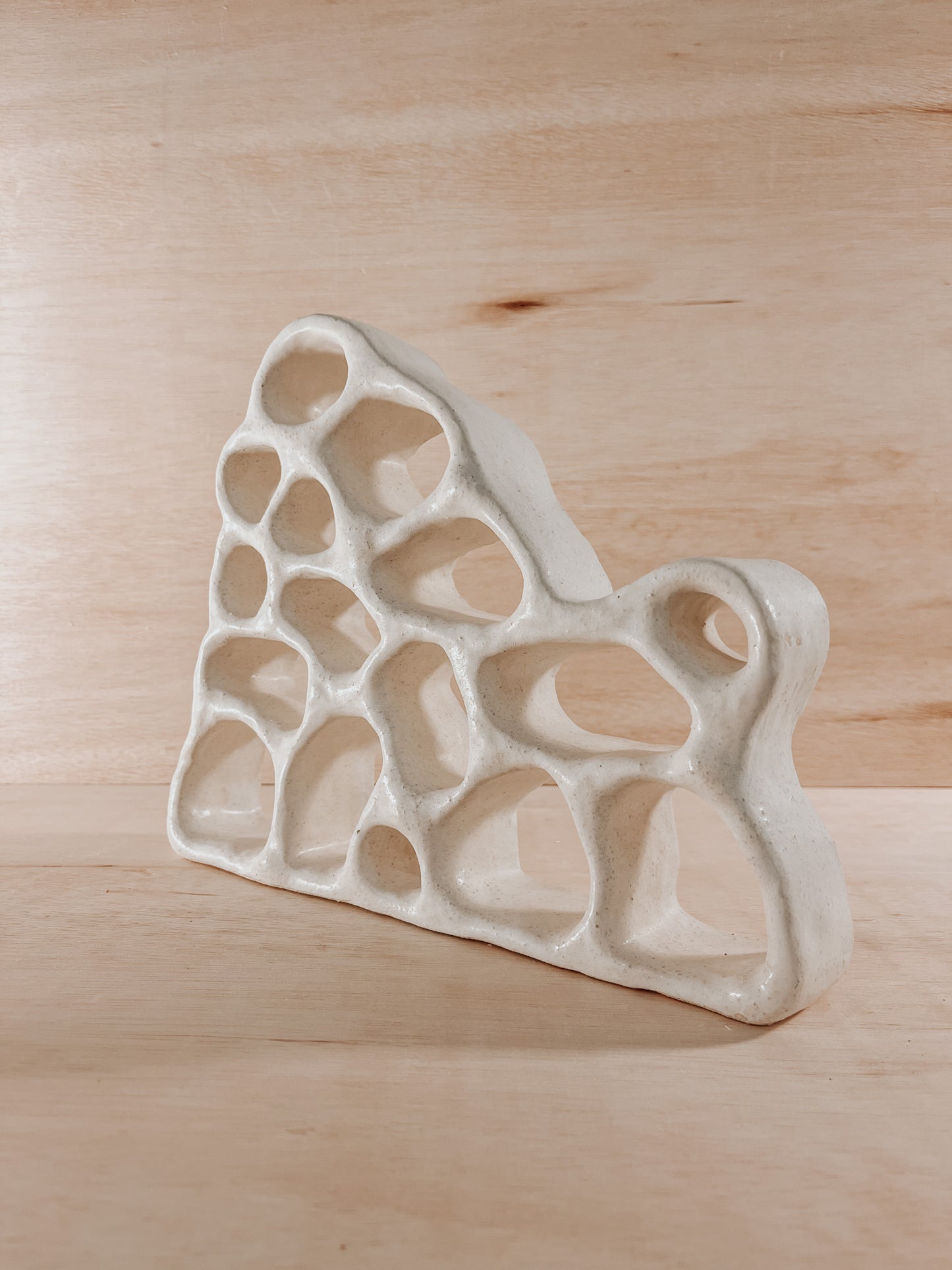 Hand-built ceramic altar with matte glaze, wall-mounted, soft curves, handmade in Boulder