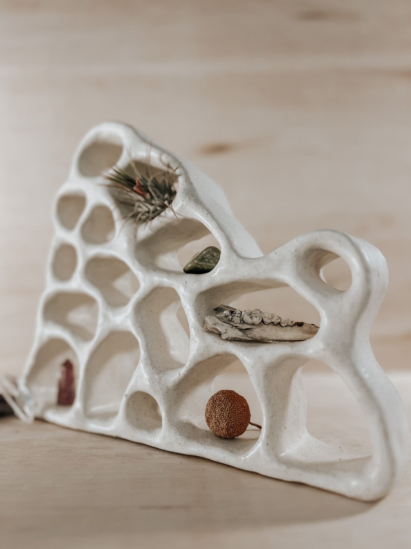 Hand-built ceramic altar with matte glaze, wall-mounted, soft curves, handmade in Boulder
