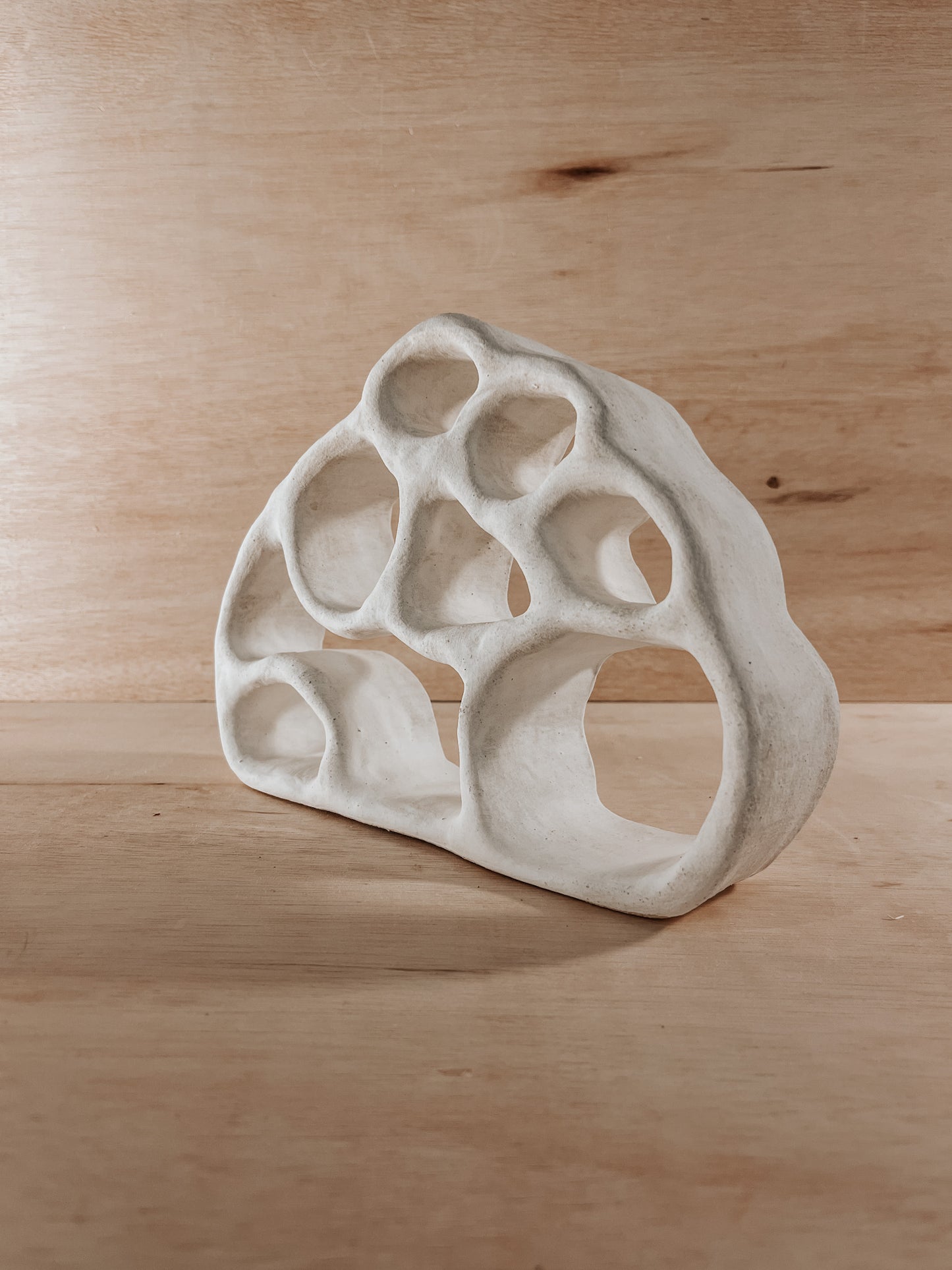 Hand-built ceramic altar with matte glaze, wall-mounted, soft curves, handmade in Boulder