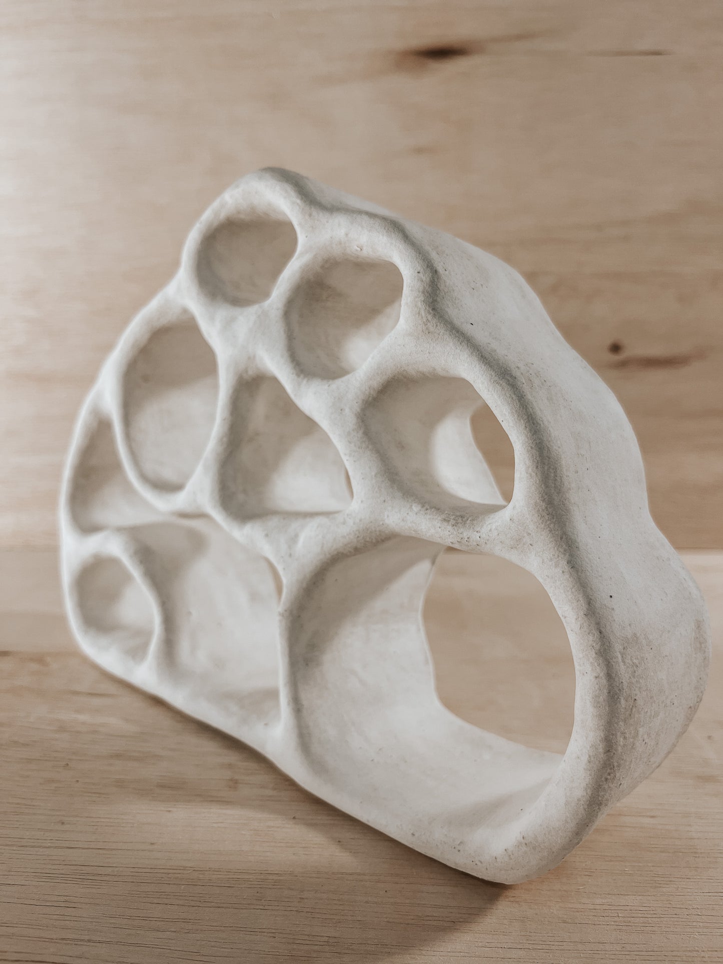Hand-built ceramic altar with matte glaze, wall-mounted, soft curves, handmade in Boulder