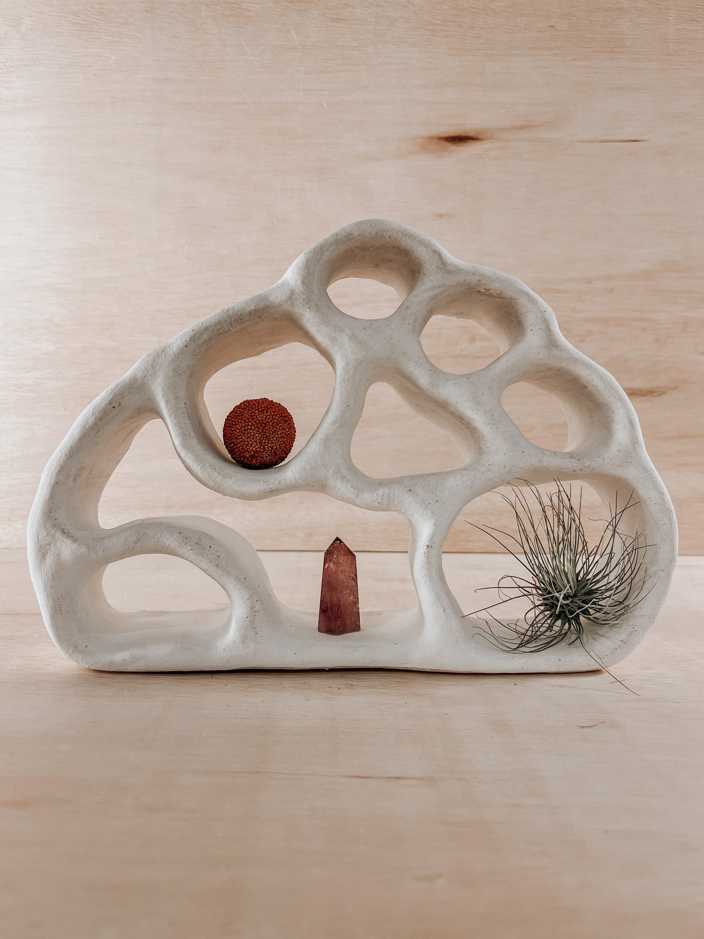 Hand-built ceramic altar with matte glaze, wall-mounted, soft curves, handmade in Boulder