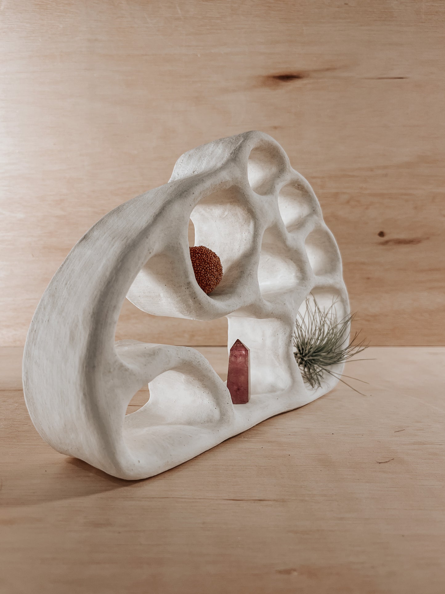 Hand-built ceramic altar with matte glaze, wall-mounted, soft curves, handmade in Boulder