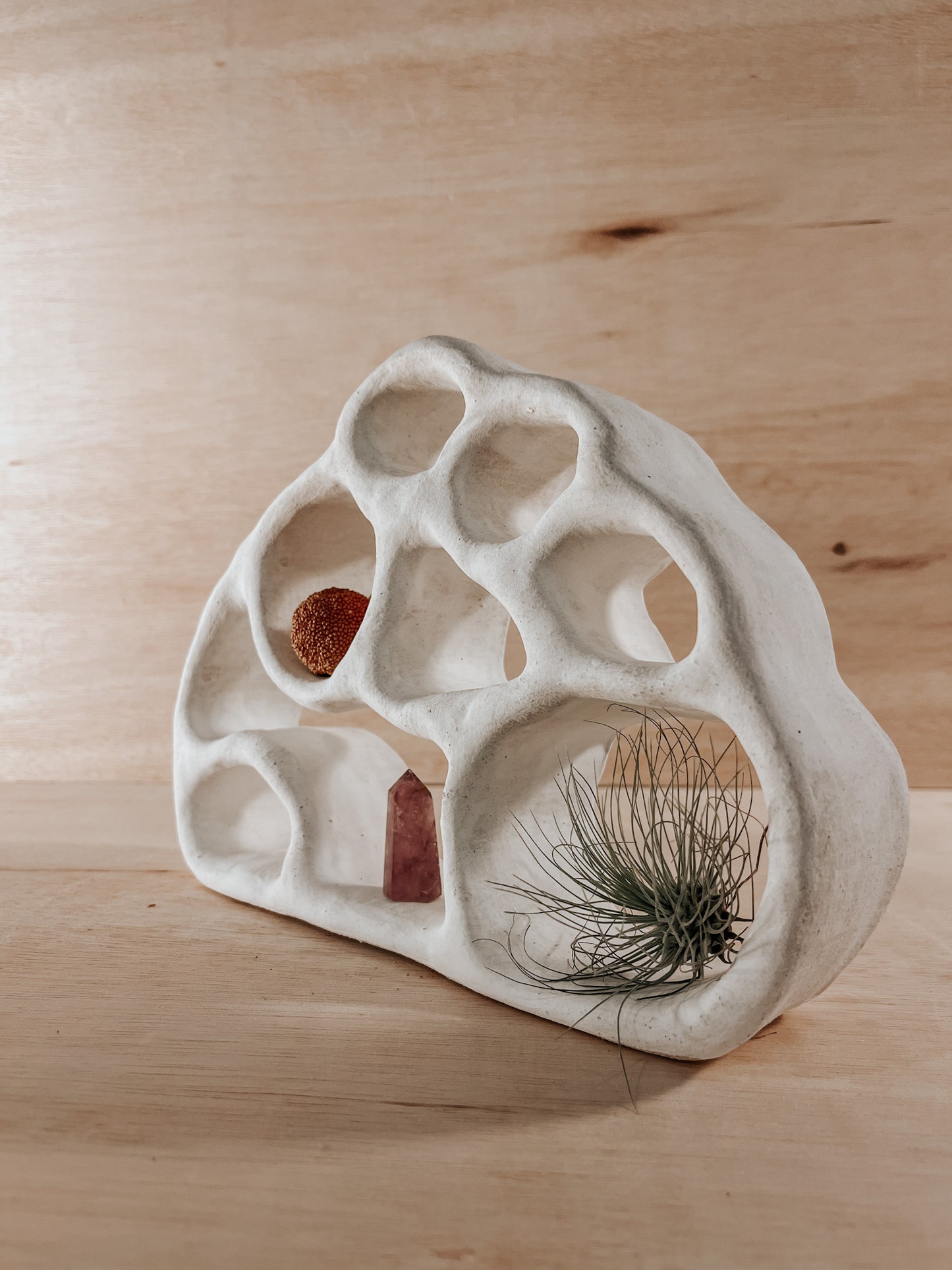 Hand-built ceramic altar with matte glaze, wall-mounted, soft curves, handmade in Boulder