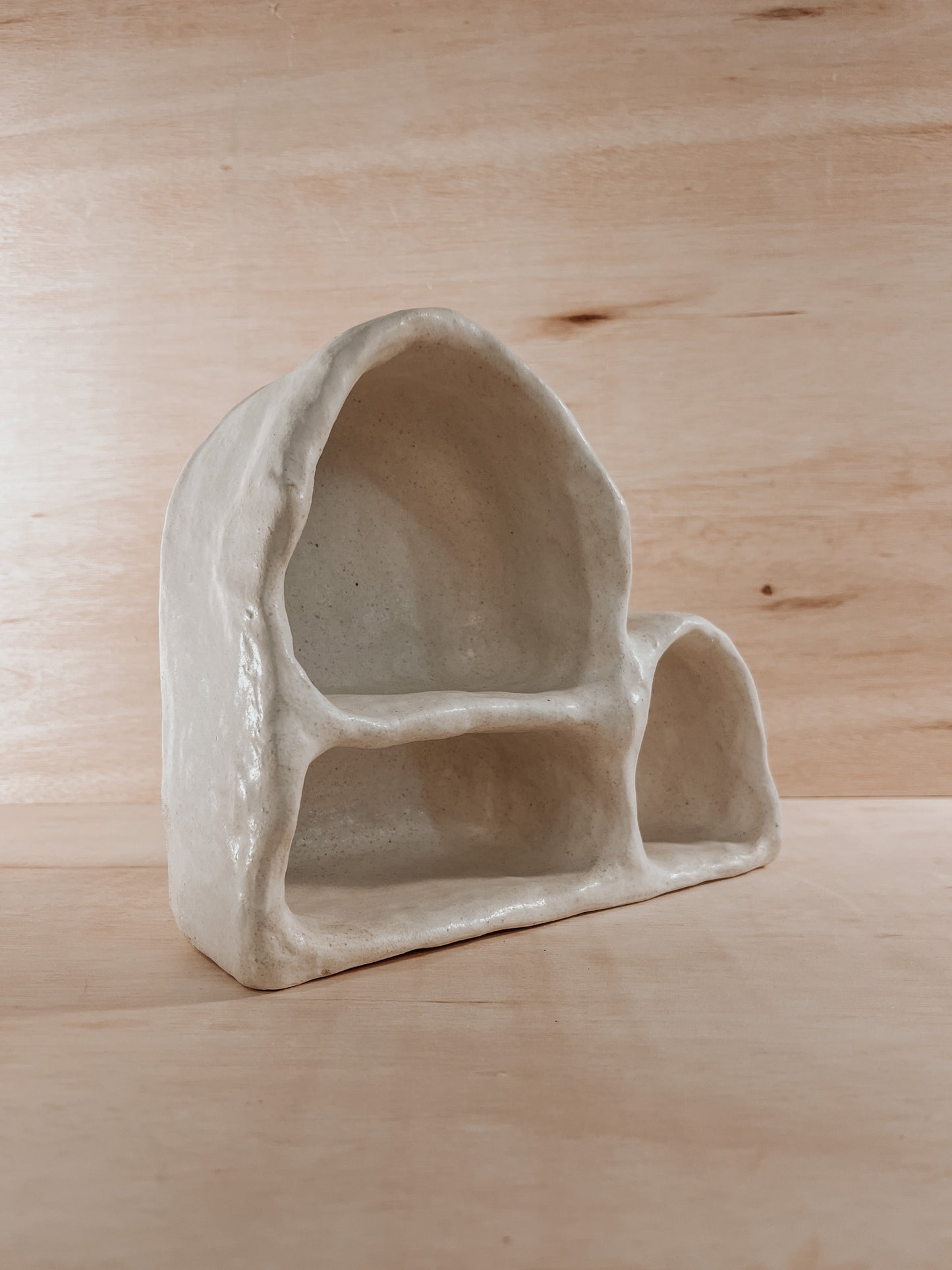 Hand-built ceramic altar with matte glaze, wall-mounted, soft curves, handmade in Boulder
