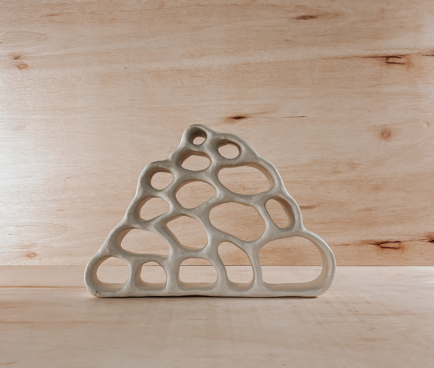 Hand-built ceramic altar with matte glaze, wall-mounted, soft curves, handmade in Boulder