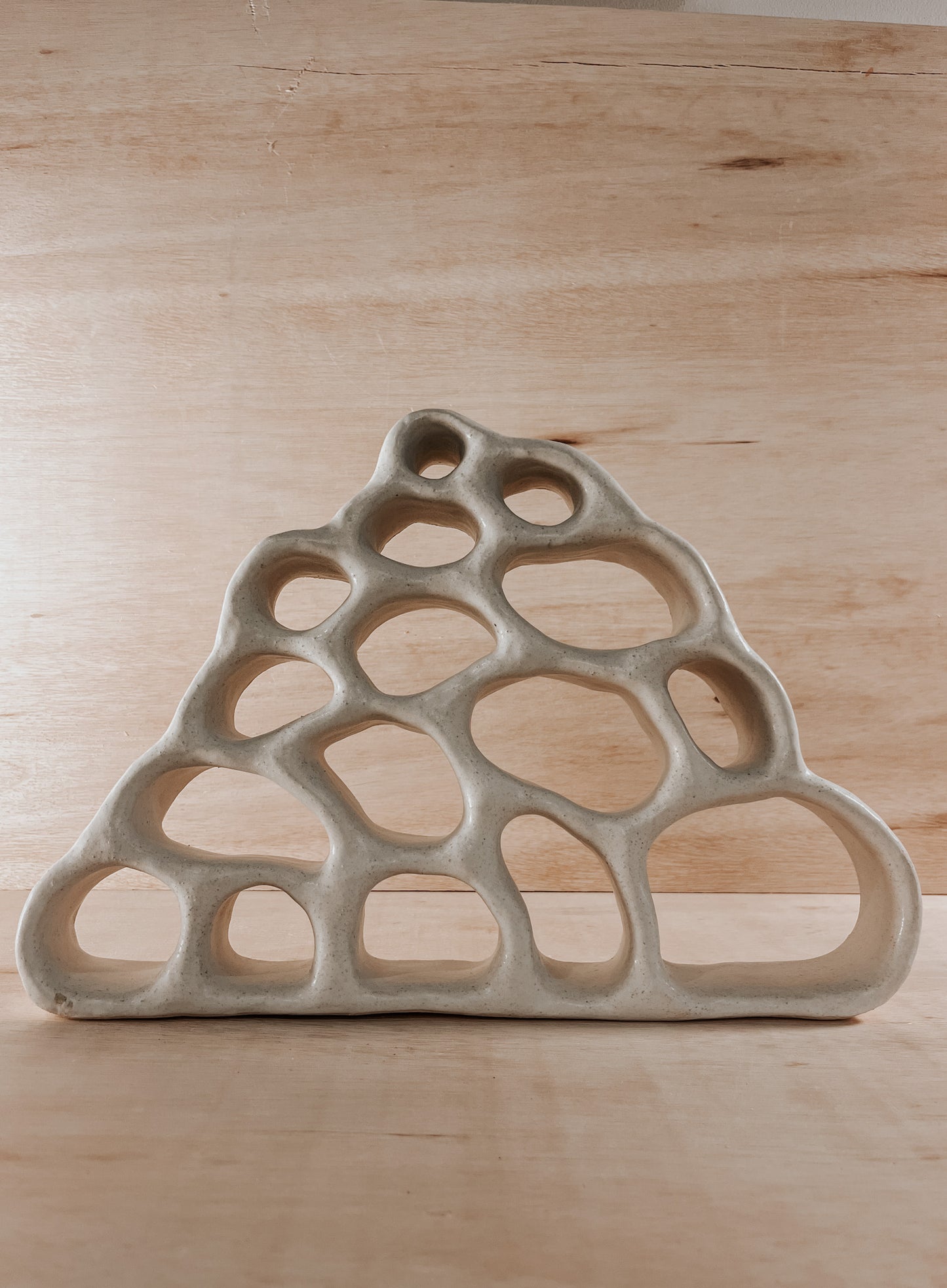 Hand-built ceramic altar with matte glaze, wall-mounted, soft curves, handmade in Boulder
