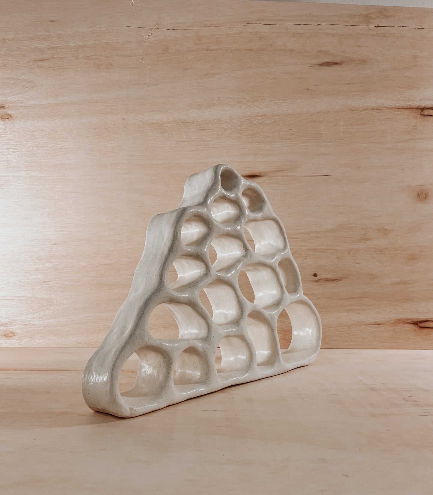 Hand-built ceramic altar with matte glaze, wall-mounted, soft curves, handmade in Boulder