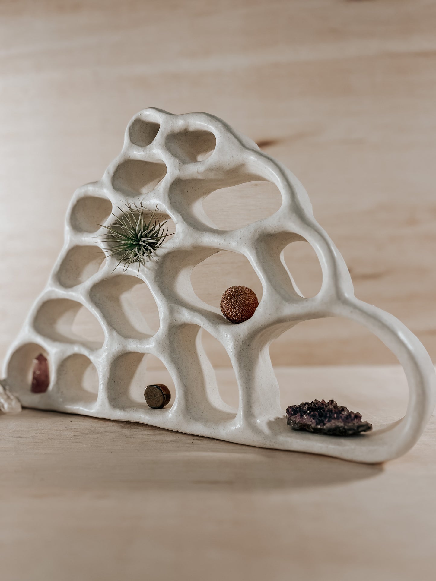 Hand-built ceramic altar with matte glaze, wall-mounted, soft curves, handmade in Boulder