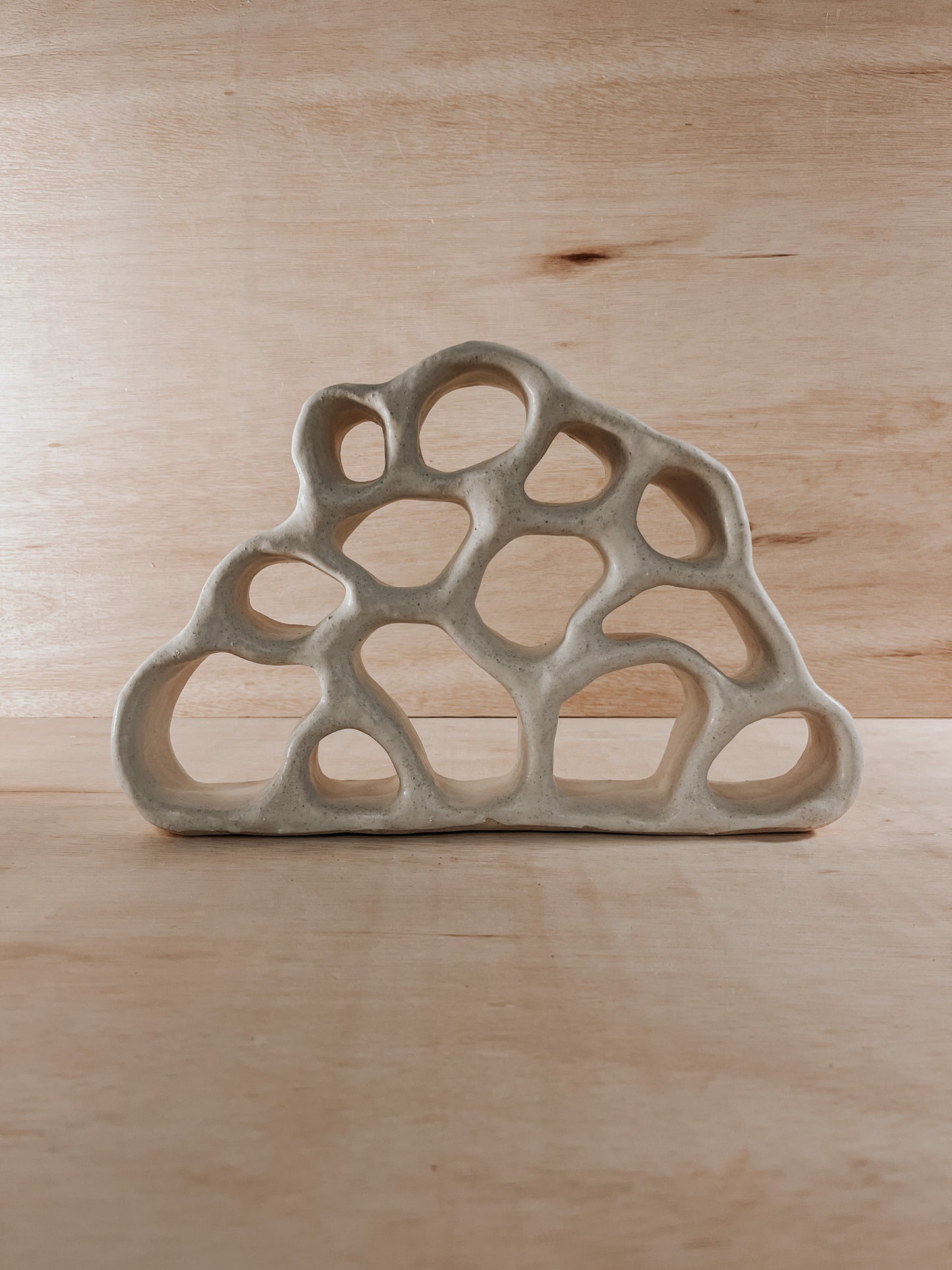 Hand-built ceramic altar with matte glaze, wall-mounted, soft curves, handmade in Boulder