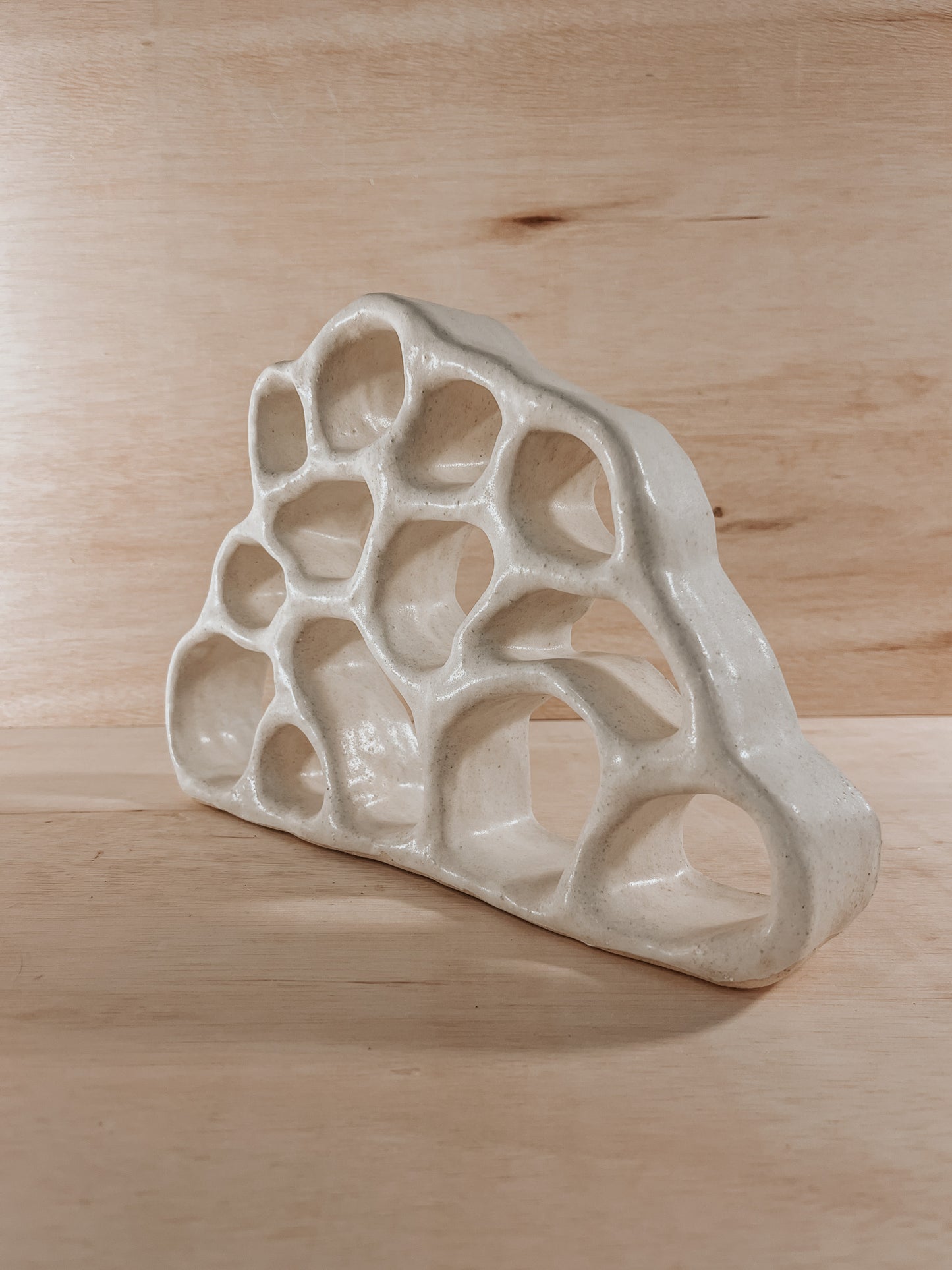 Hand-built ceramic altar with matte glaze, wall-mounted, soft curves, handmade in Boulder