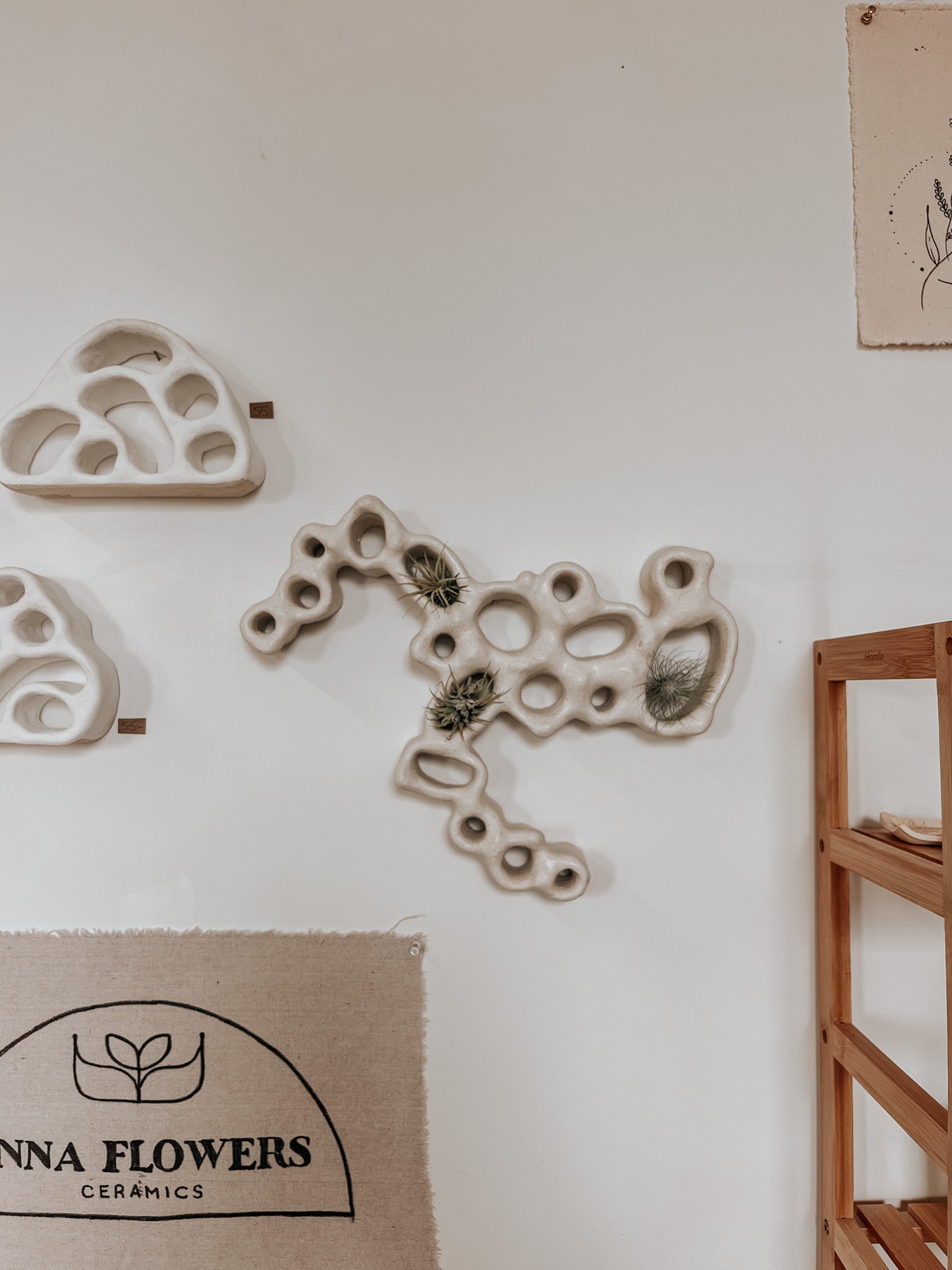 Hand-built ceramic altar with matte glaze, wall-mounted, soft curves, handmade in Boulder