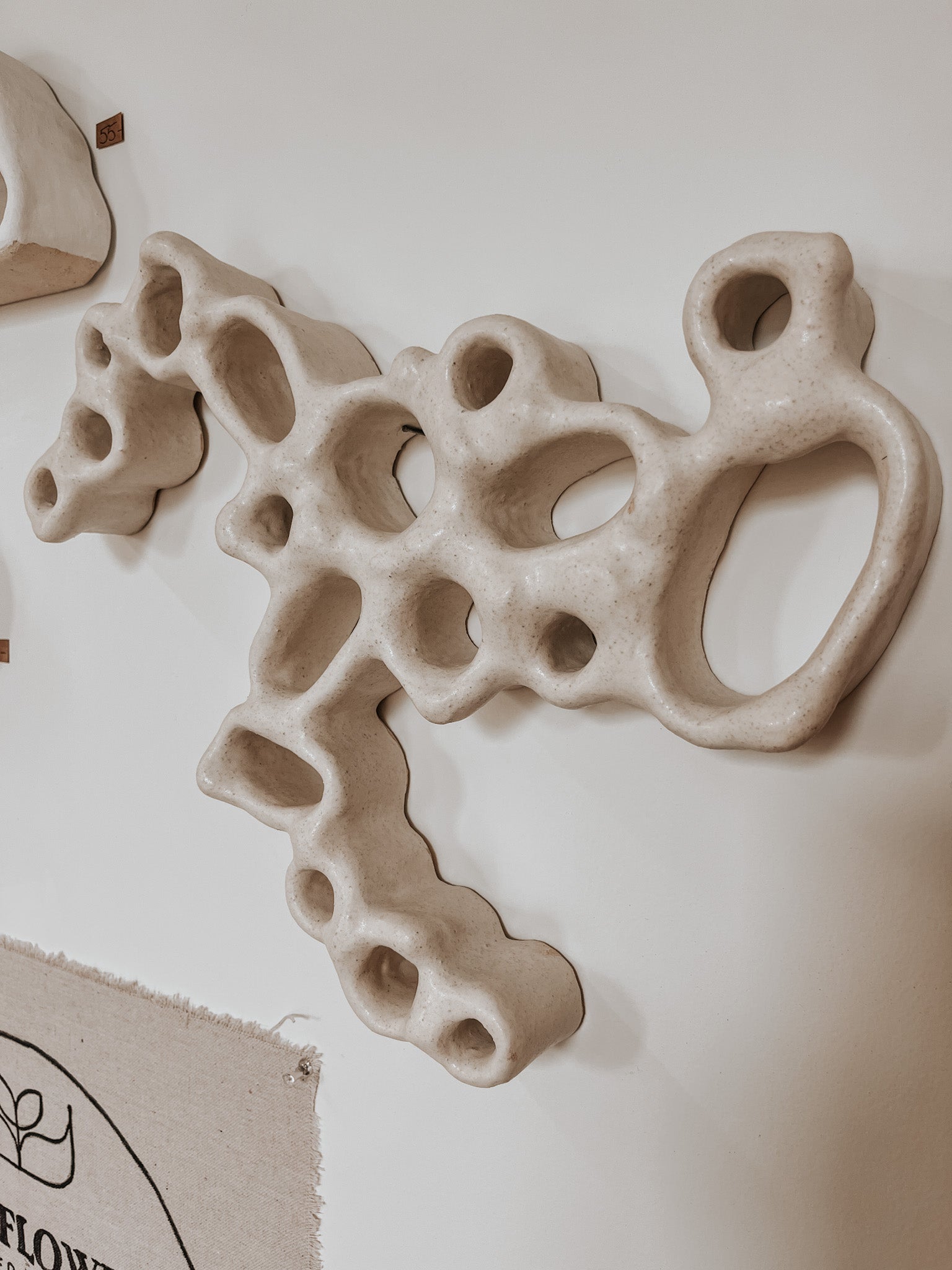 Hand-built ceramic altar with matte glaze, wall-mounted, soft curves, handmade in Boulder