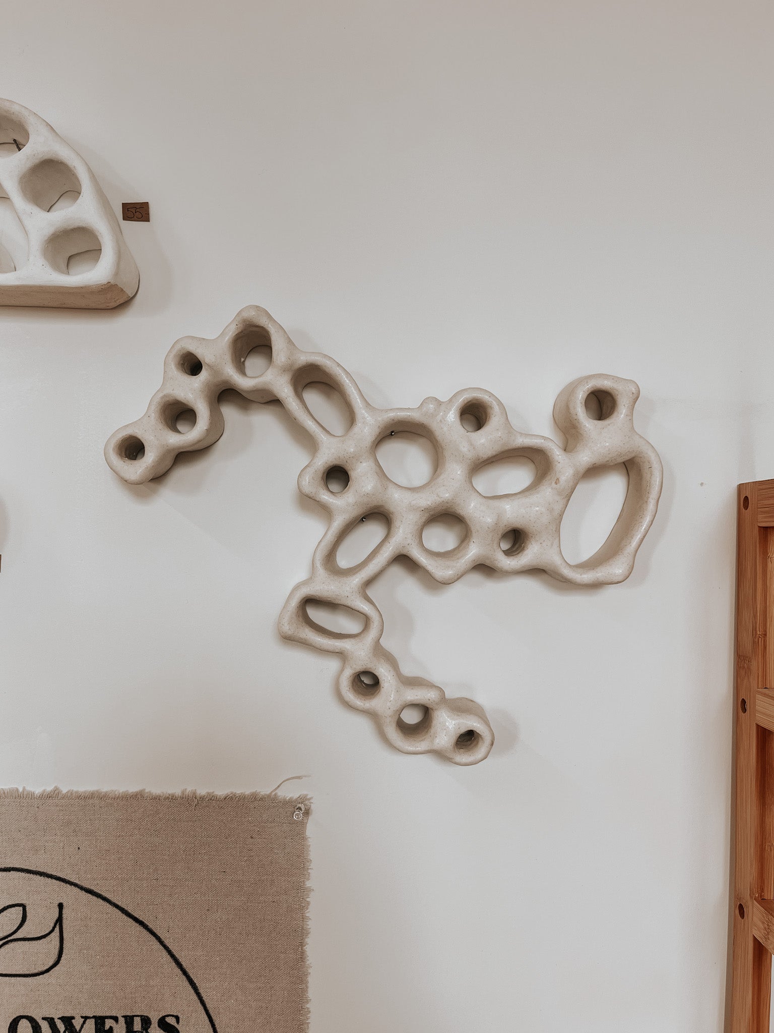 Hand-built ceramic altar with matte glaze, wall-mounted, soft curves, handmade in Boulder