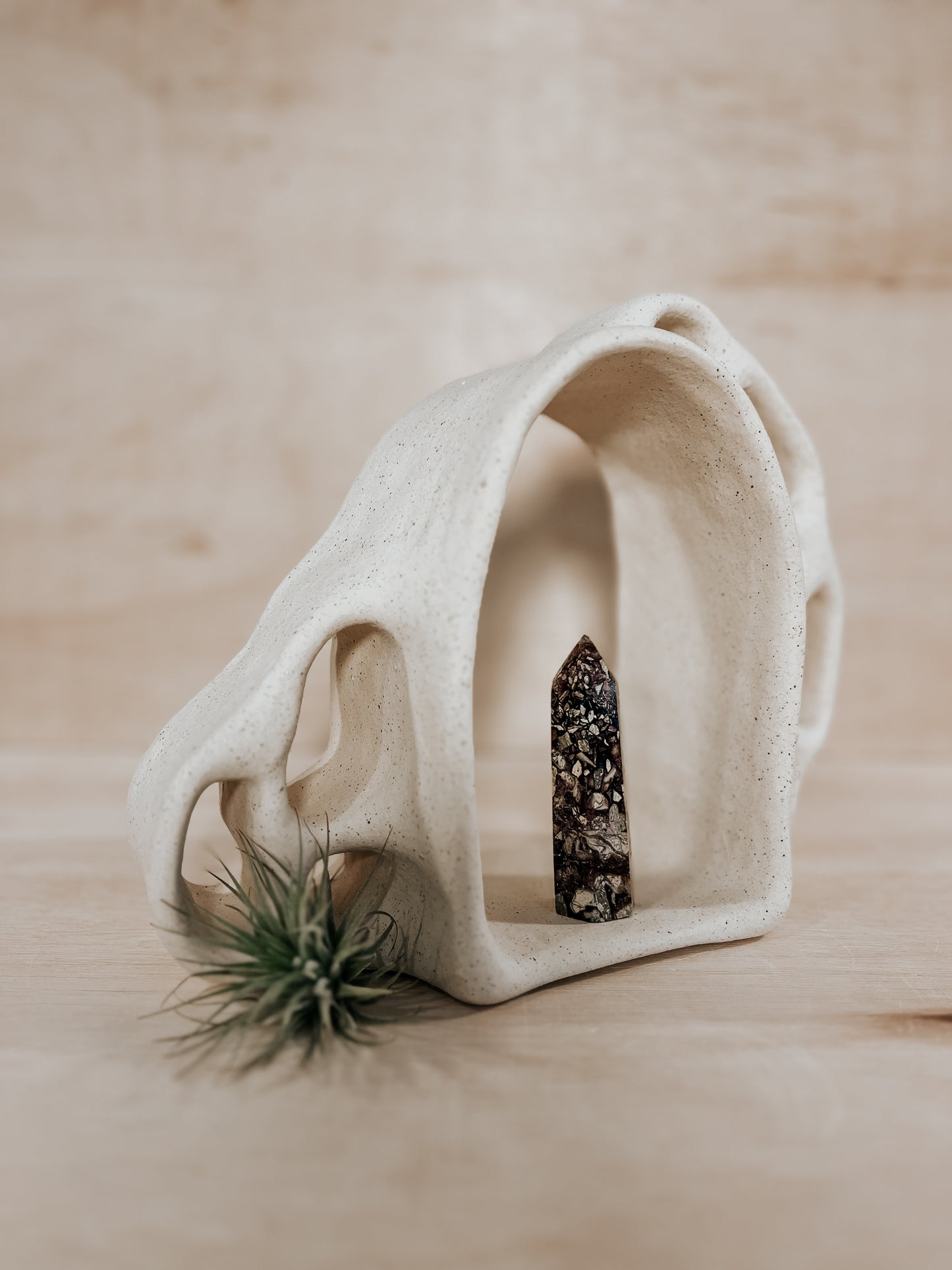 Hand-built ceramic altar with matte glaze, wall-mounted, soft curves, handmade in Boulder