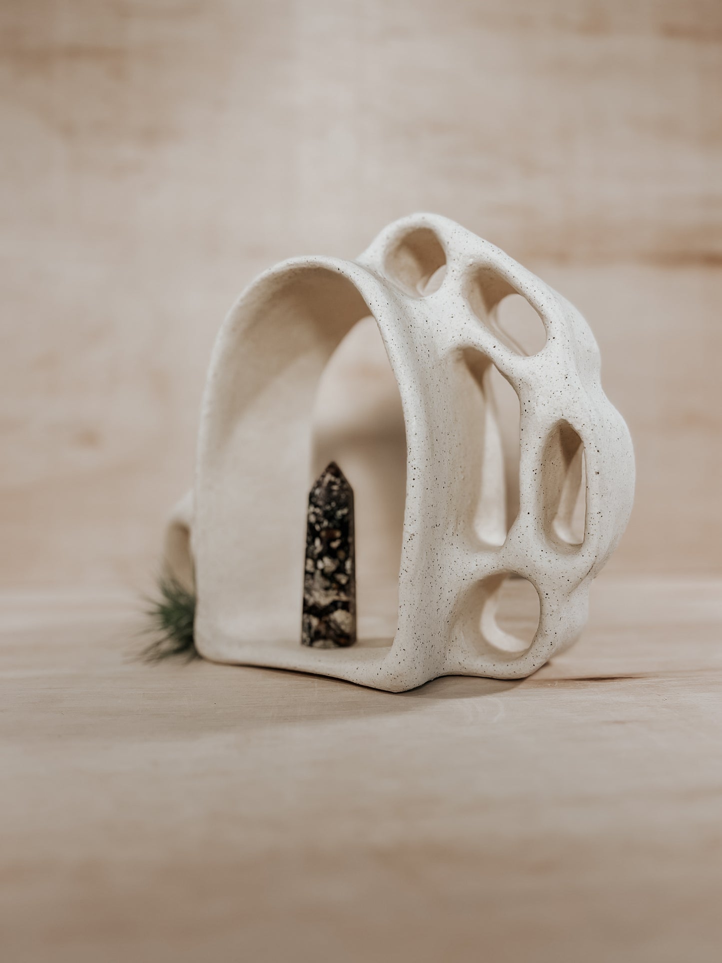 Hand-built ceramic altar with matte glaze, wall-mounted, soft curves, handmade in Boulder