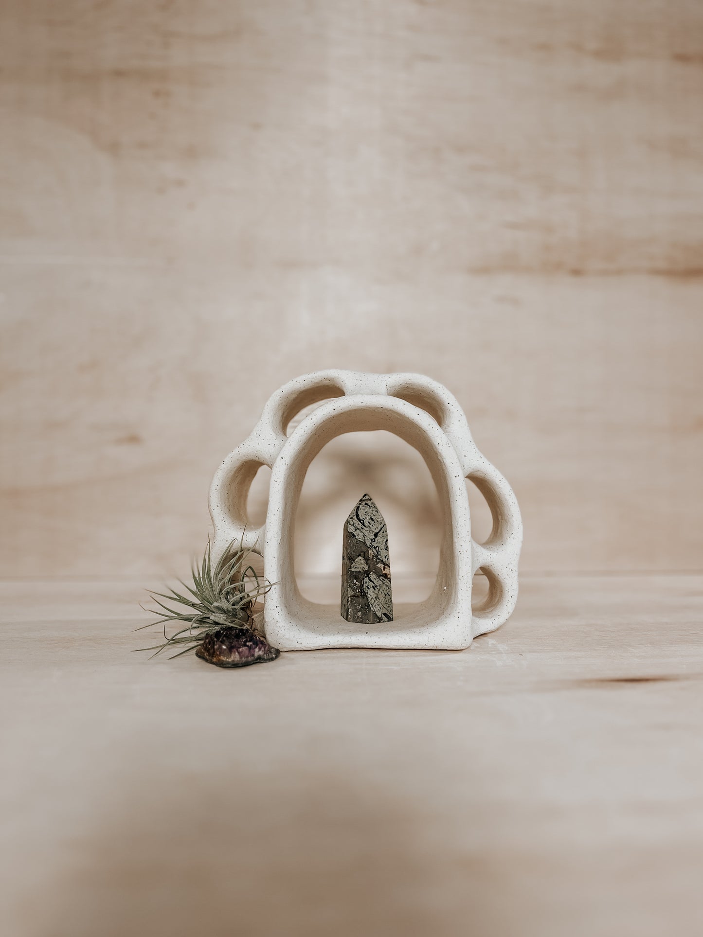 Hand-built ceramic altar with matte glaze, wall-mounted, soft curves, handmade in Boulder