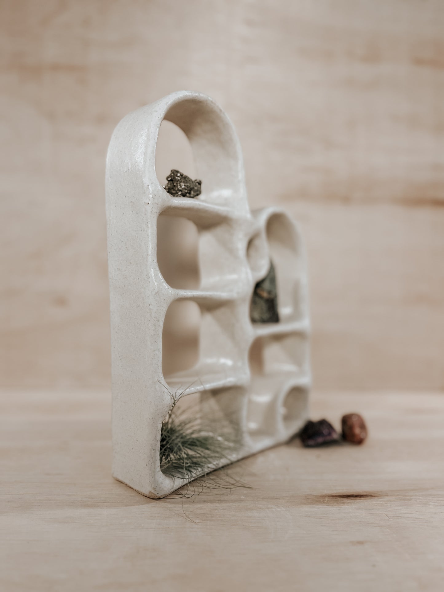 Hand-built ceramic altar with matte glaze, wall-mounted, soft curves, handmade in Boulder