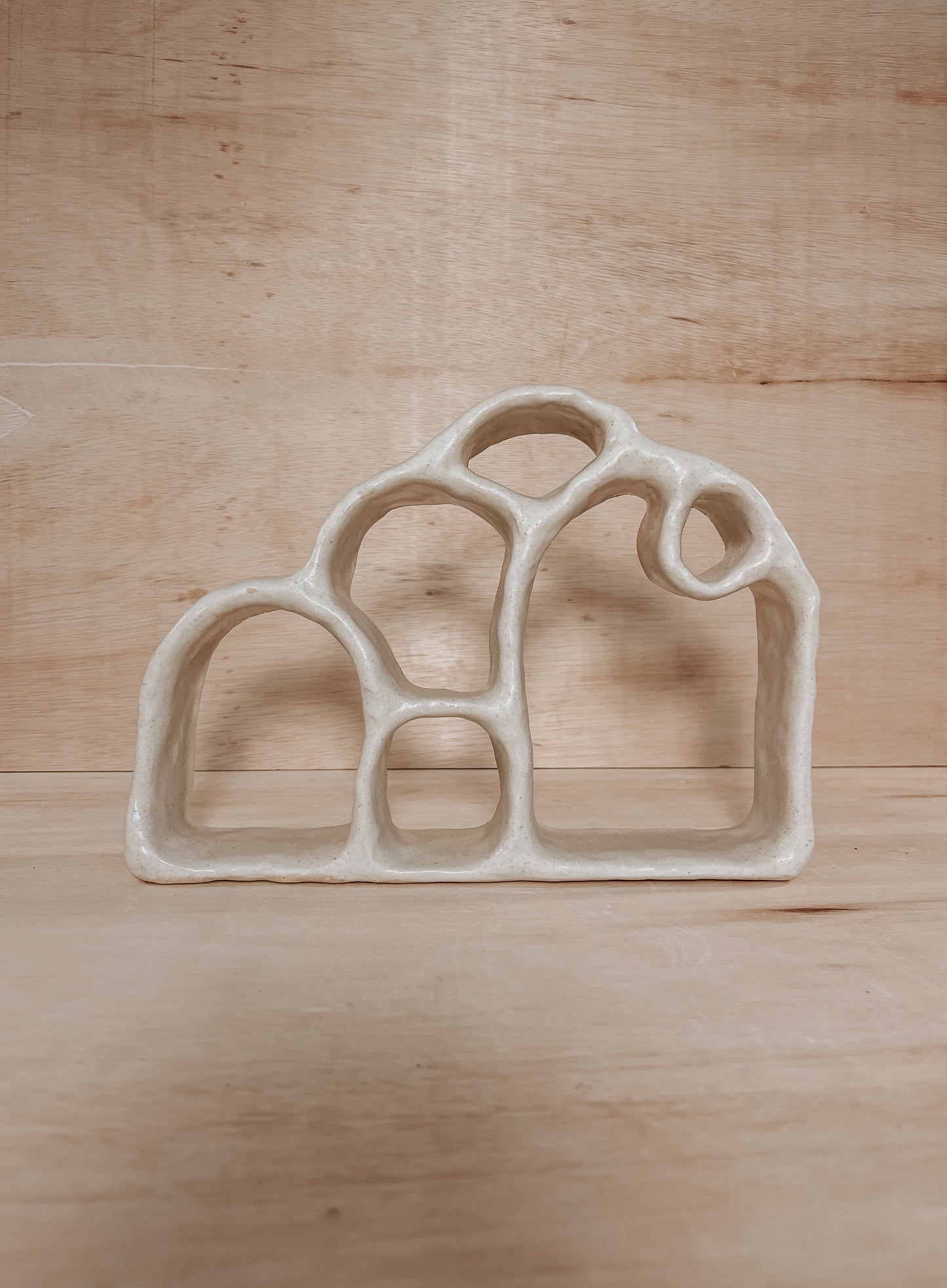 Hand-built ceramic altar with matte glaze, wall-mounted, soft curves, handmade in Boulder