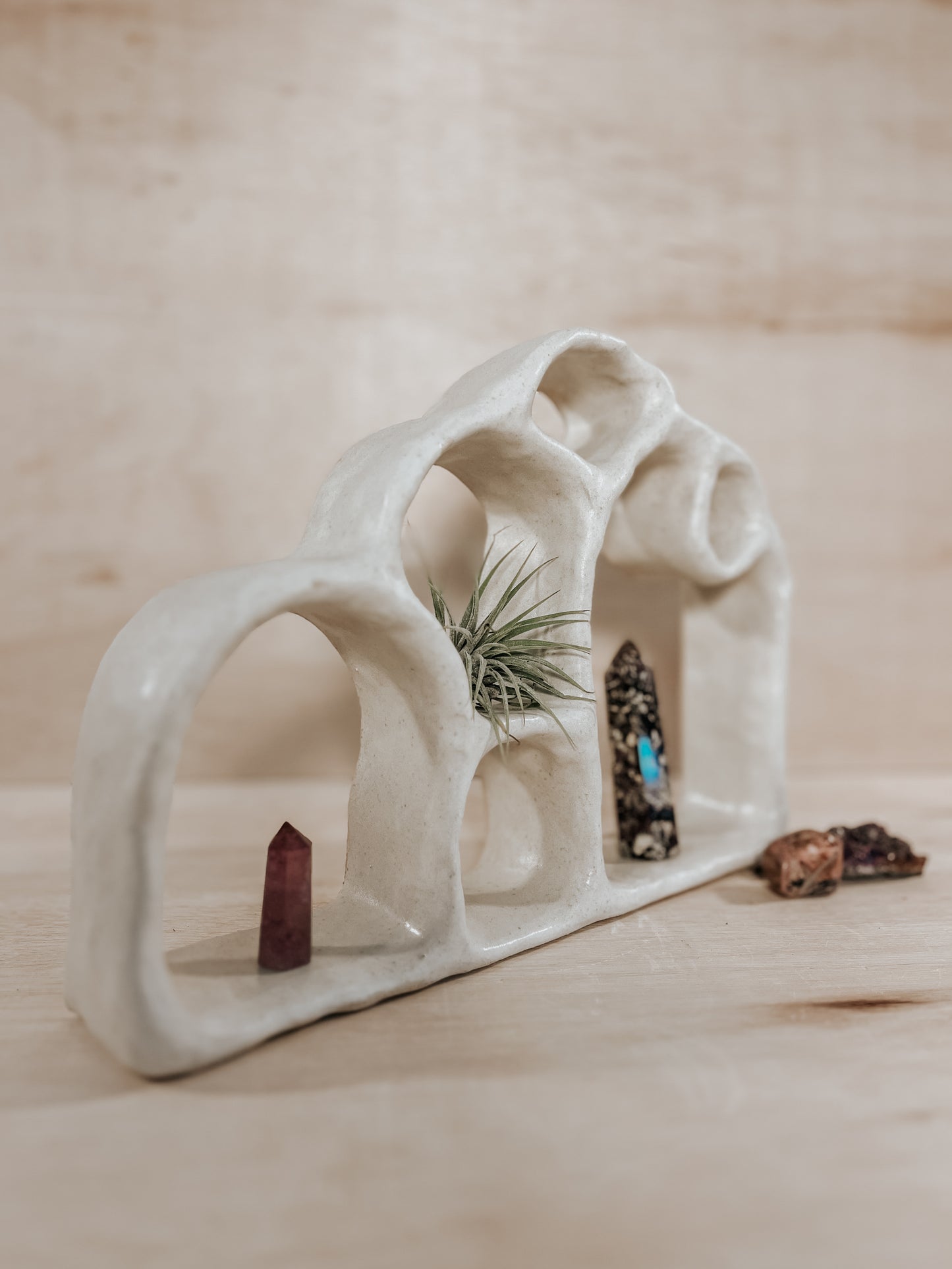 Hand-built ceramic altar with matte glaze, wall-mounted, soft curves, handmade in Boulder