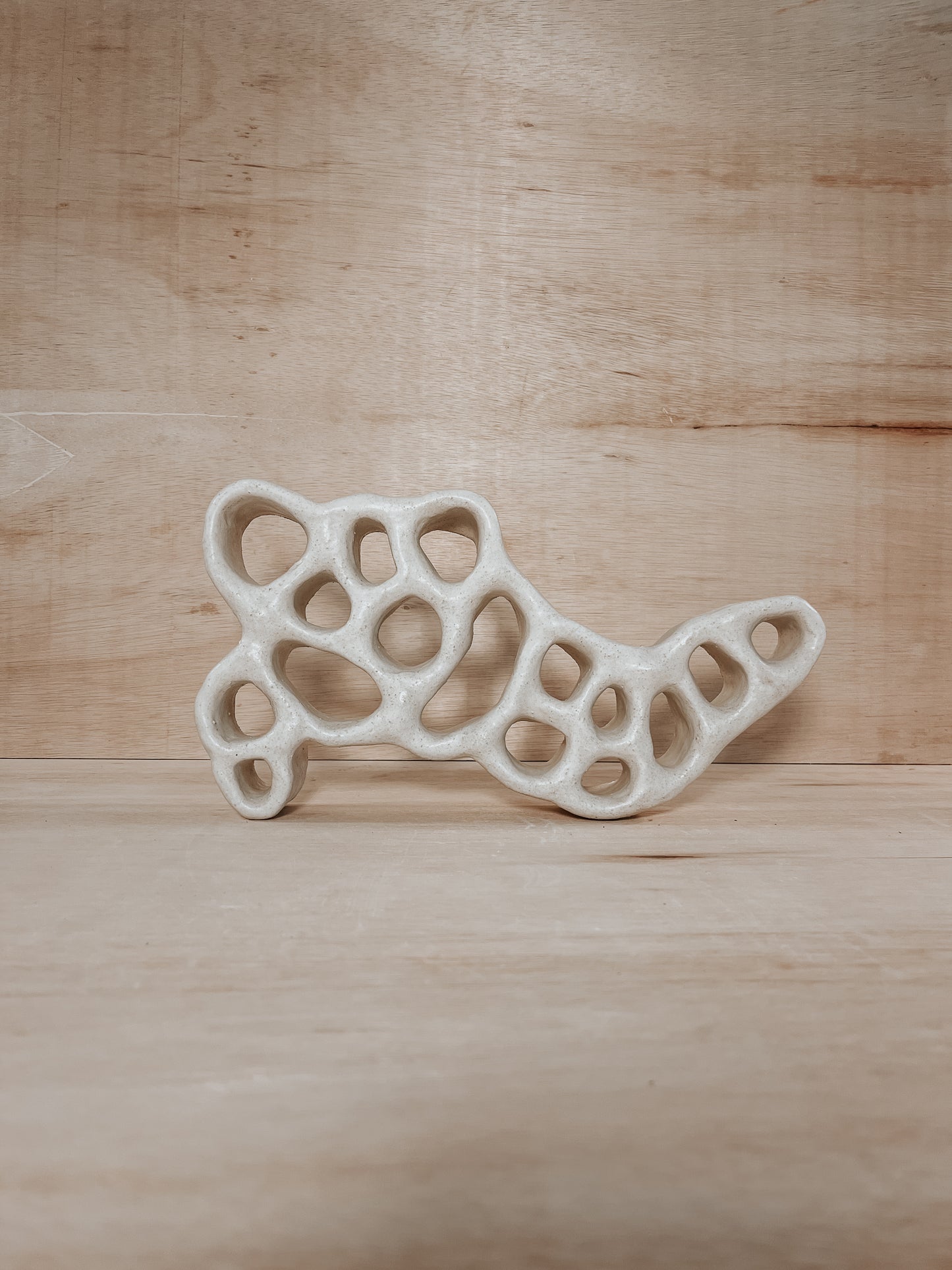 Hand-built ceramic altar with matte glaze, wall-mounted, soft curves, handmade in Boulder