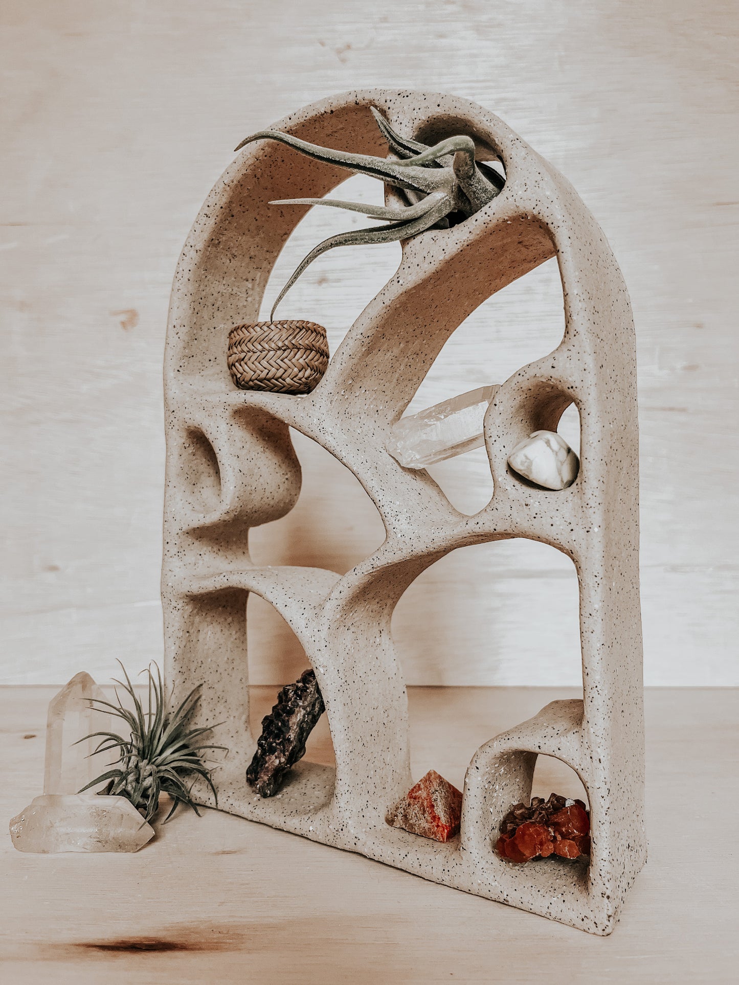 Student hand-building a ceramic altar in pottery class at Boulder art studio