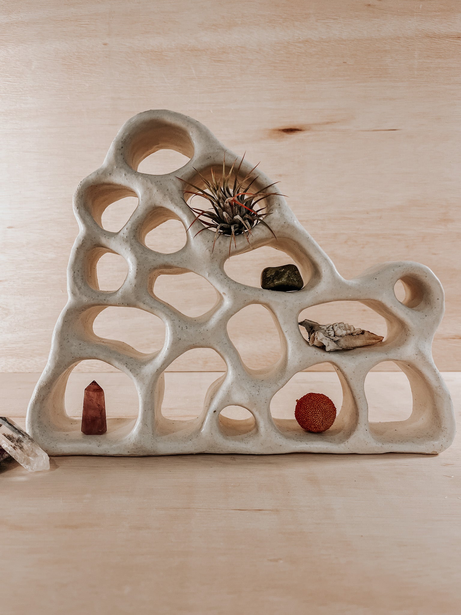 Hand-built ceramic altar with matte glaze, wall-mounted, soft curves, handmade in Boulder