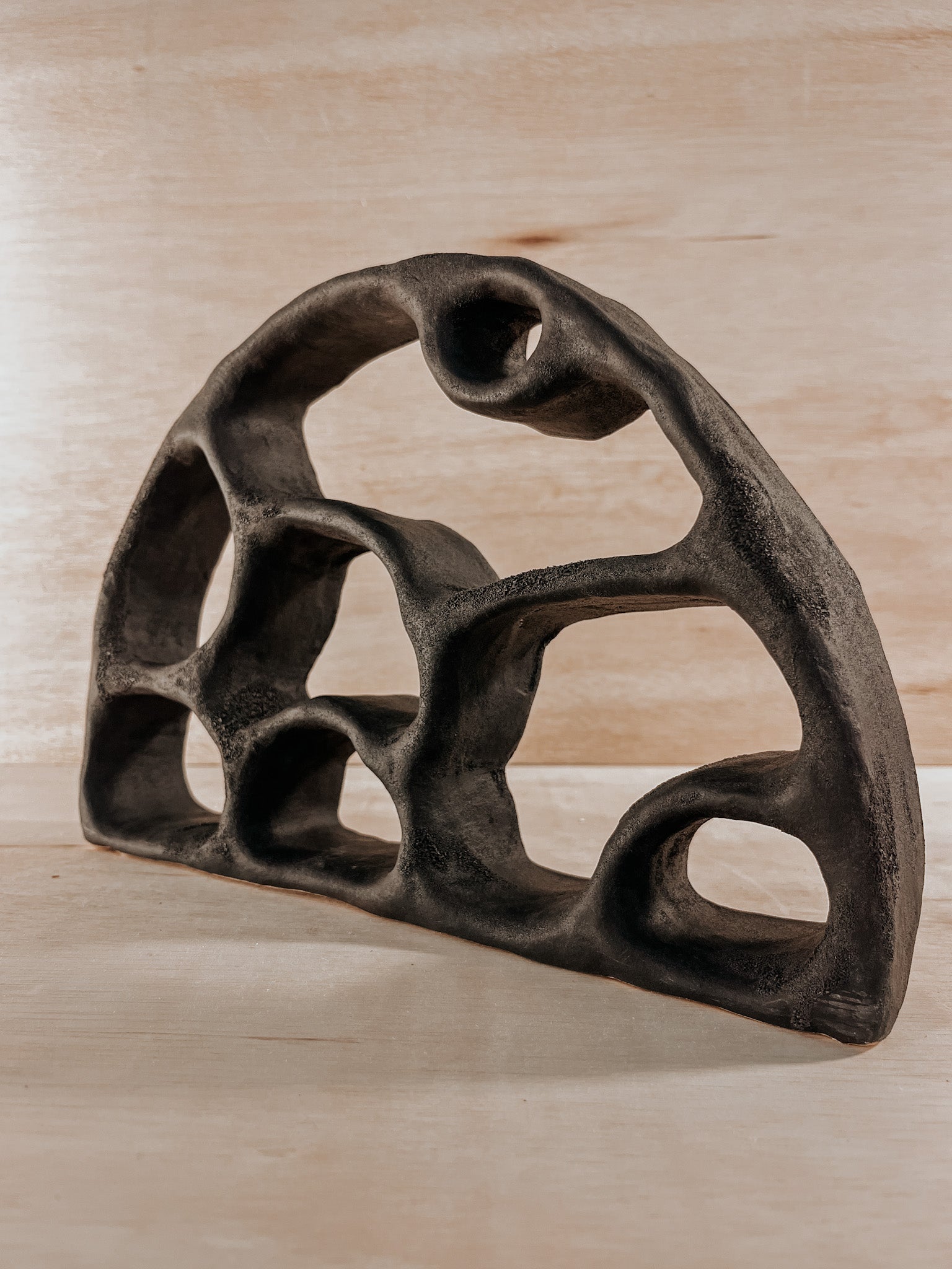 Hand-built ceramic altar with matte glaze, wall-mounted, soft curves, handmade in Boulder