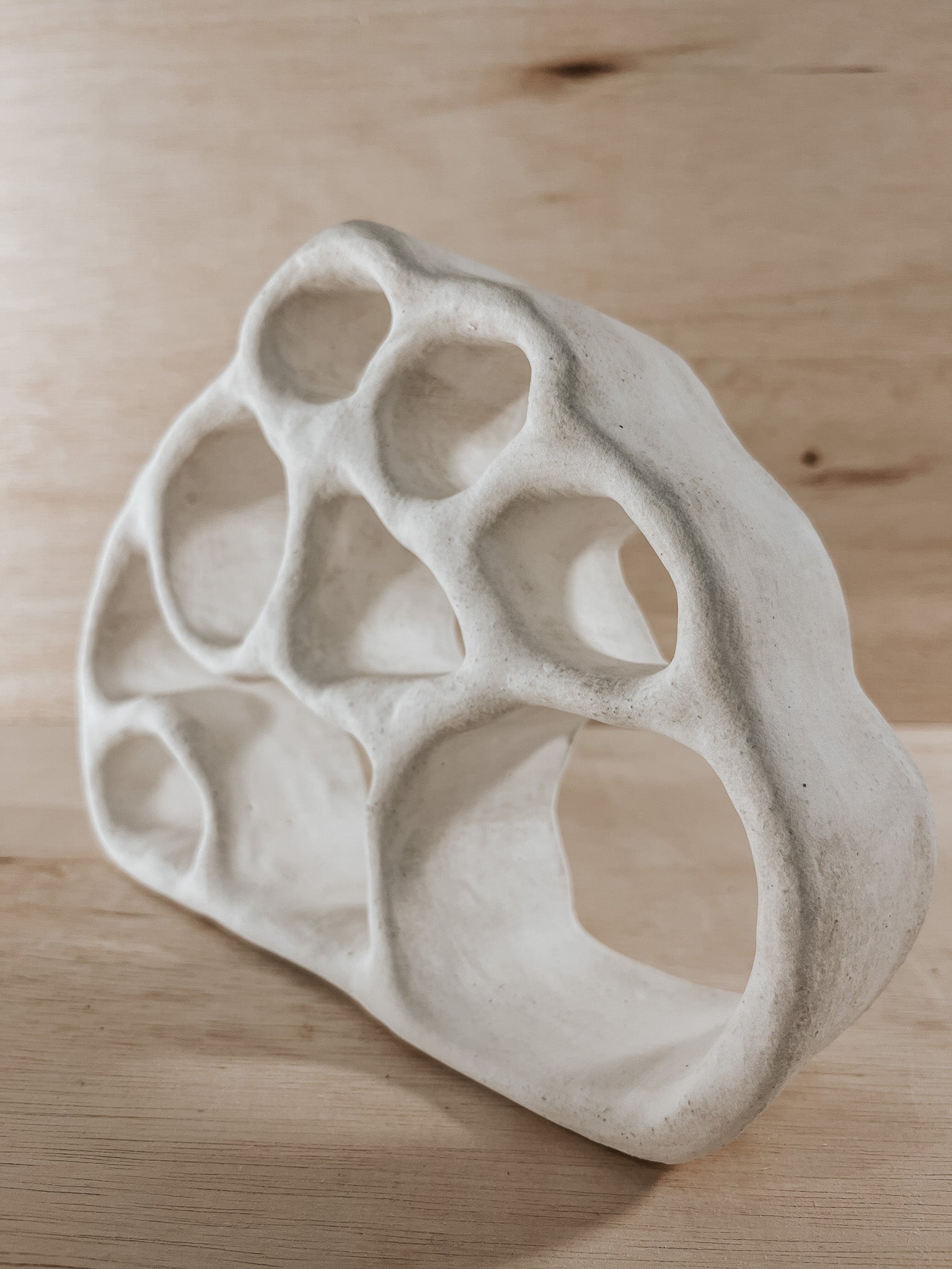 Hand-built ceramic altar with matte glaze, wall-mounted, soft curves, handmade in Boulder
