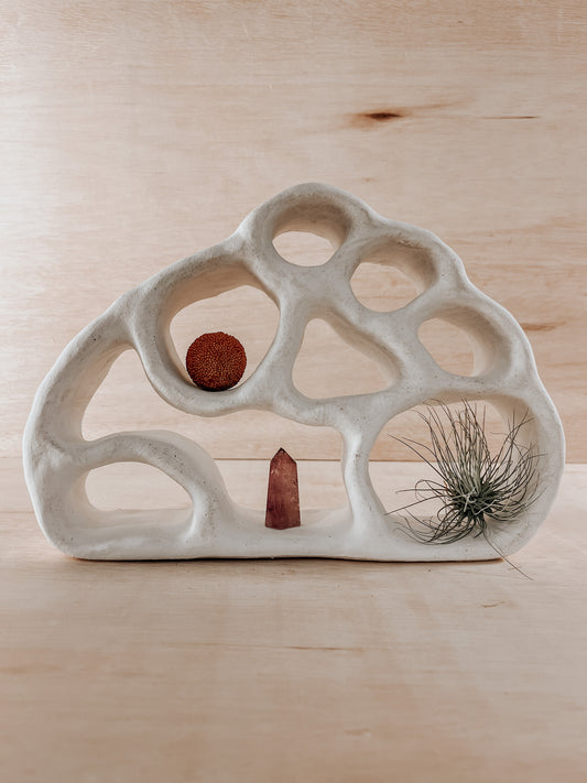 Hand-built ceramic altar with matte glaze, wall-mounted, soft curves, handmade in Boulder