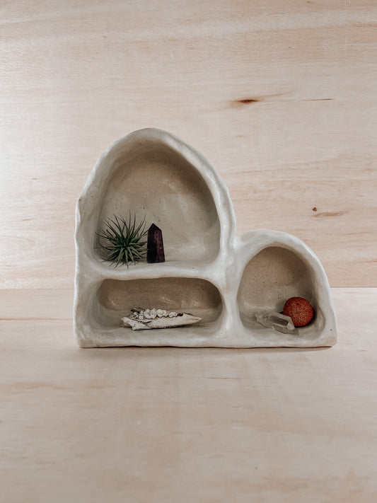 Hand-built ceramic altar with matte glaze, wall-mounted, soft curves, handmade in Boulder