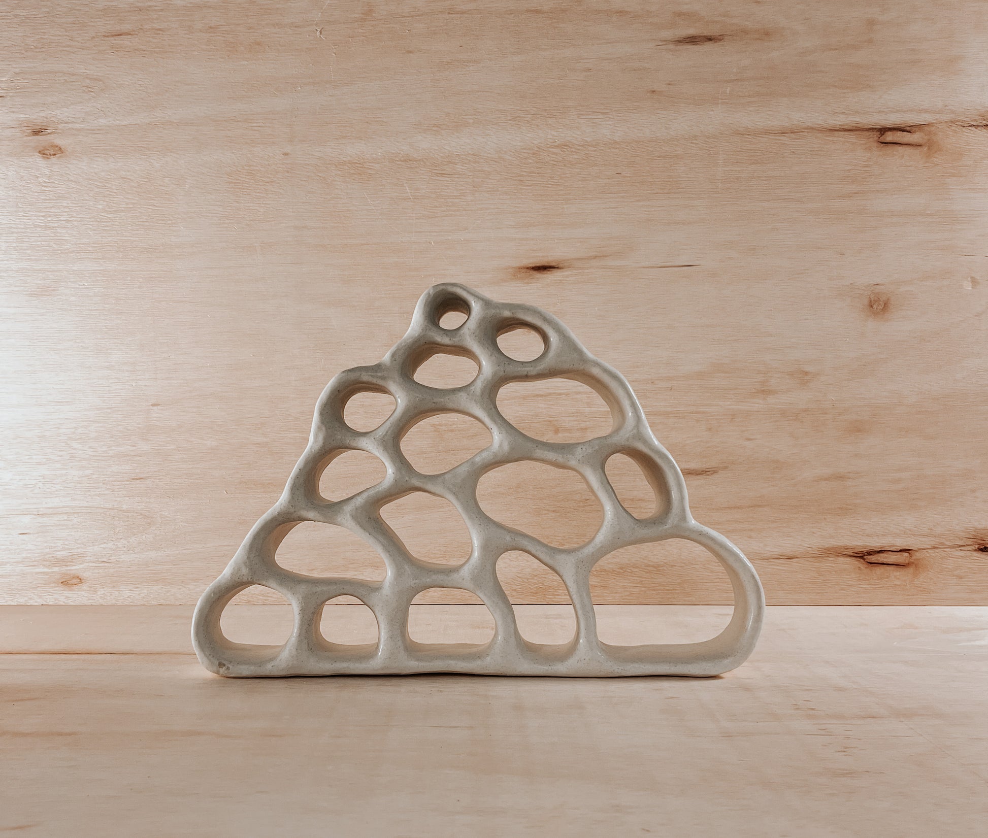 Hand-built ceramic altar with matte glaze, wall-mounted, soft curves, handmade in Boulder