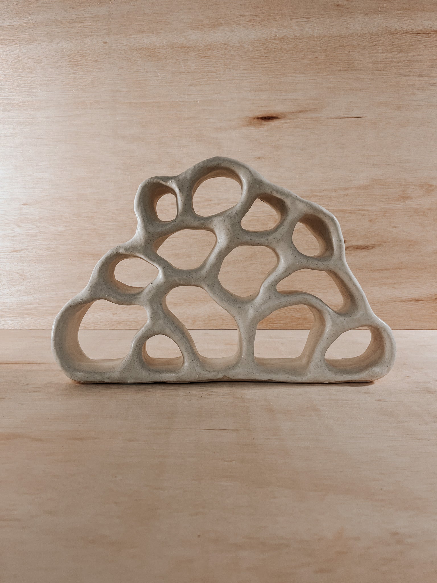 Hand-built ceramic altar with matte glaze, wall-mounted, soft curves, handmade in Boulder