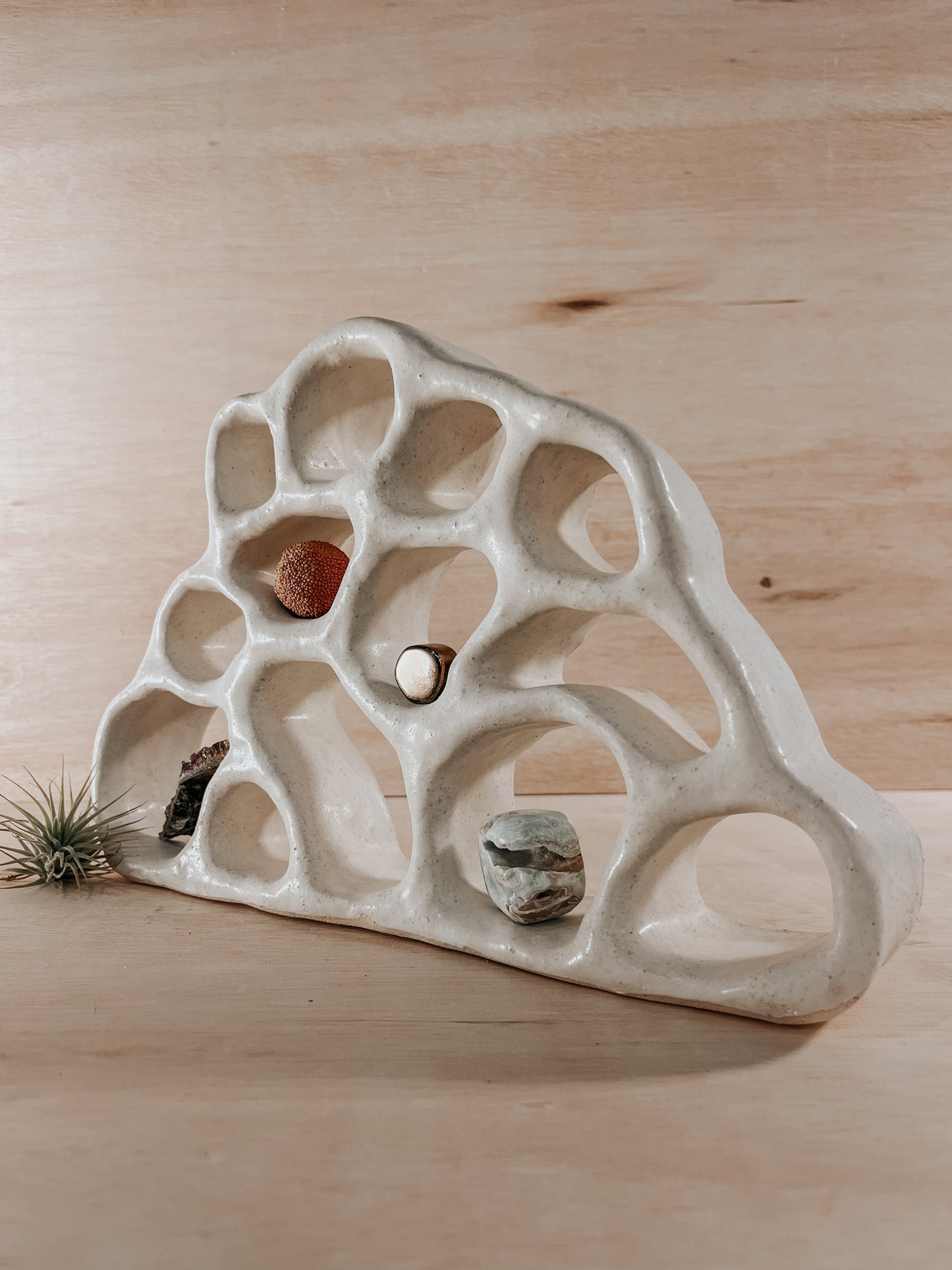 Hand-built ceramic altar with matte glaze, wall-mounted, soft curves, handmade in Boulder