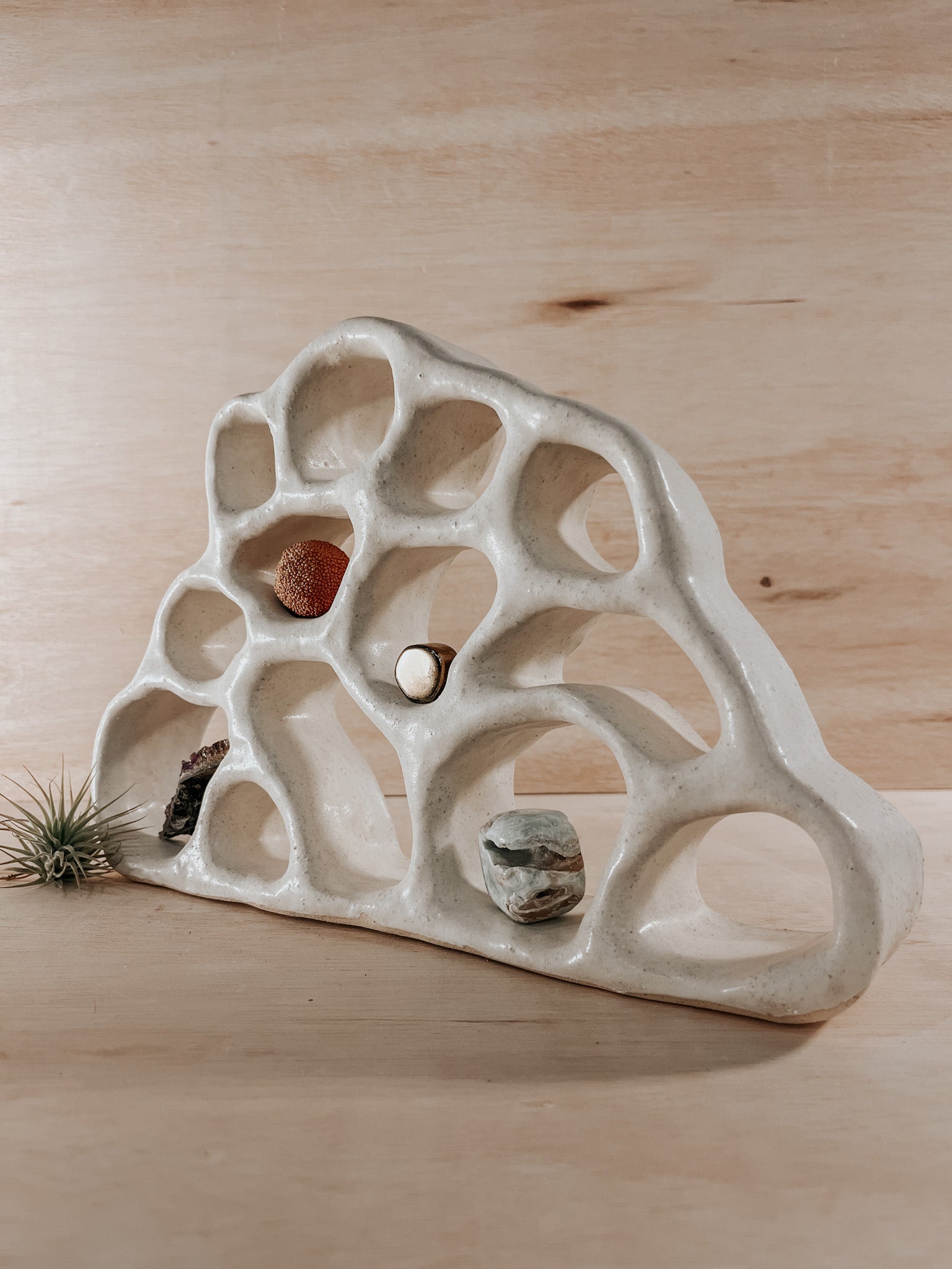 Hand-built ceramic altar with matte glaze, wall-mounted, soft curves, handmade in Boulder