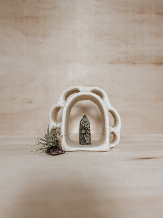 Hand-built ceramic altar with matte glaze, wall-mounted, soft curves, handmade in Boulder