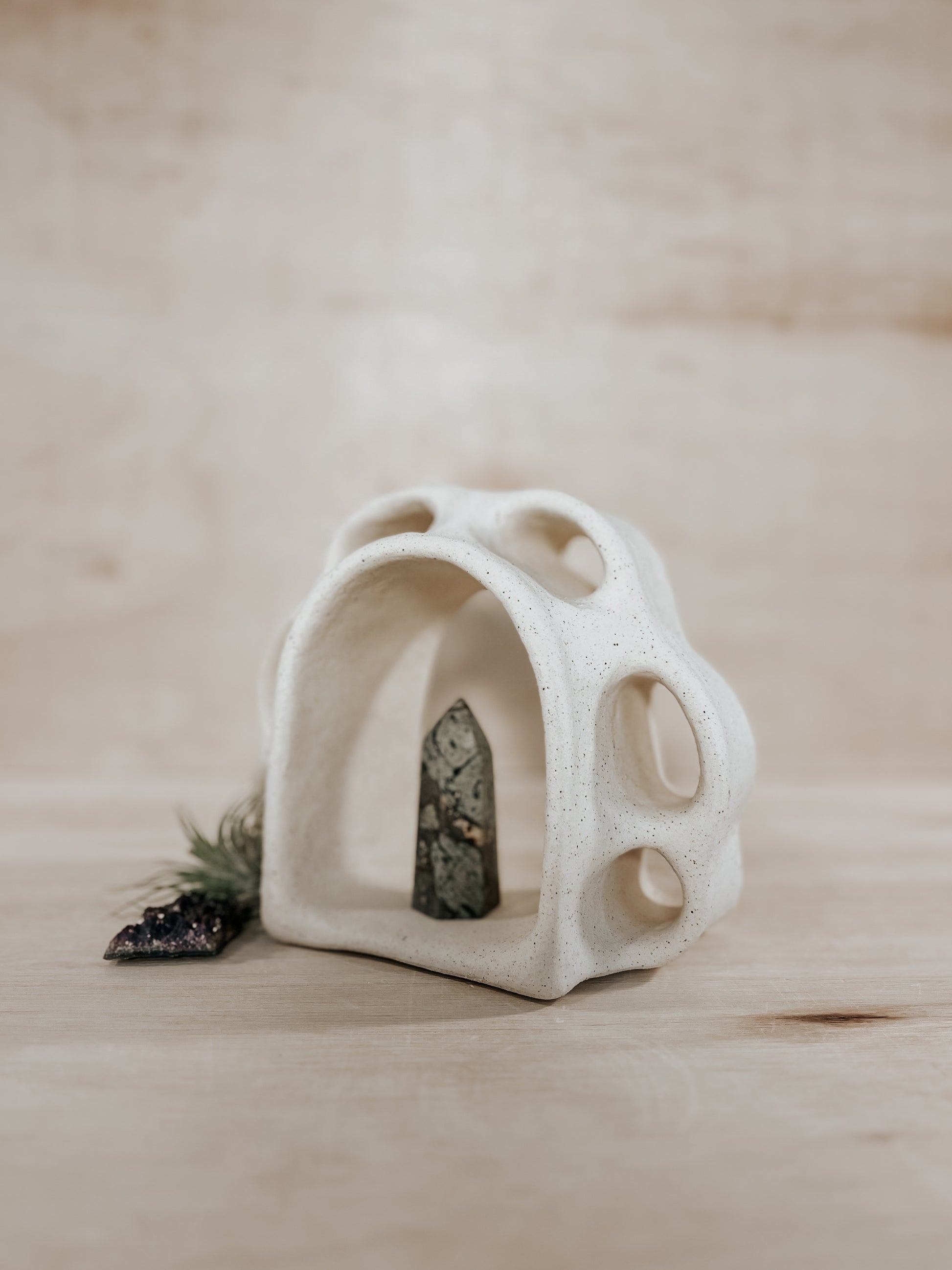 Hand-built ceramic altar with matte glaze, wall-mounted, soft curves, handmade in Boulder