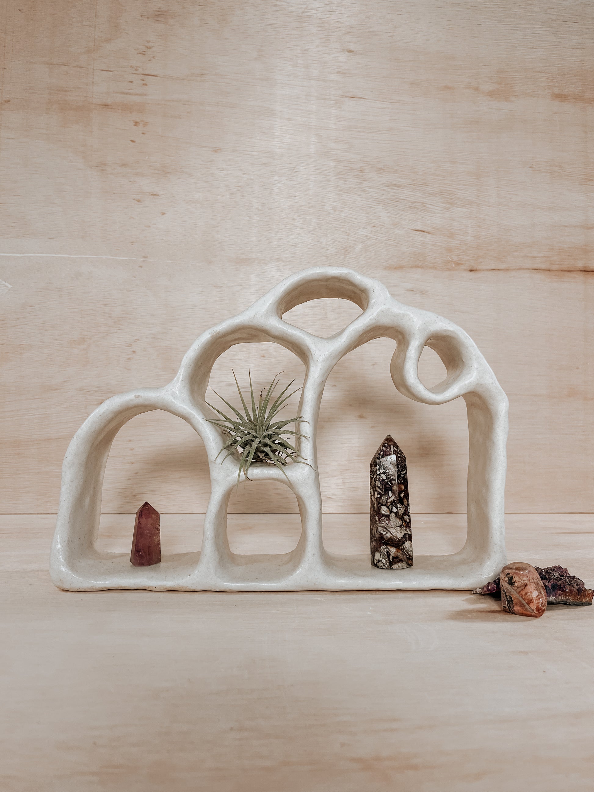 Hand-built ceramic altar with matte glaze, wall-mounted, soft curves, handmade in Boulder