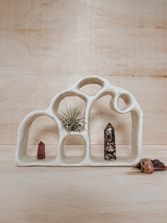 Hand-built ceramic altar with matte glaze, wall-mounted, soft curves, handmade in Boulder