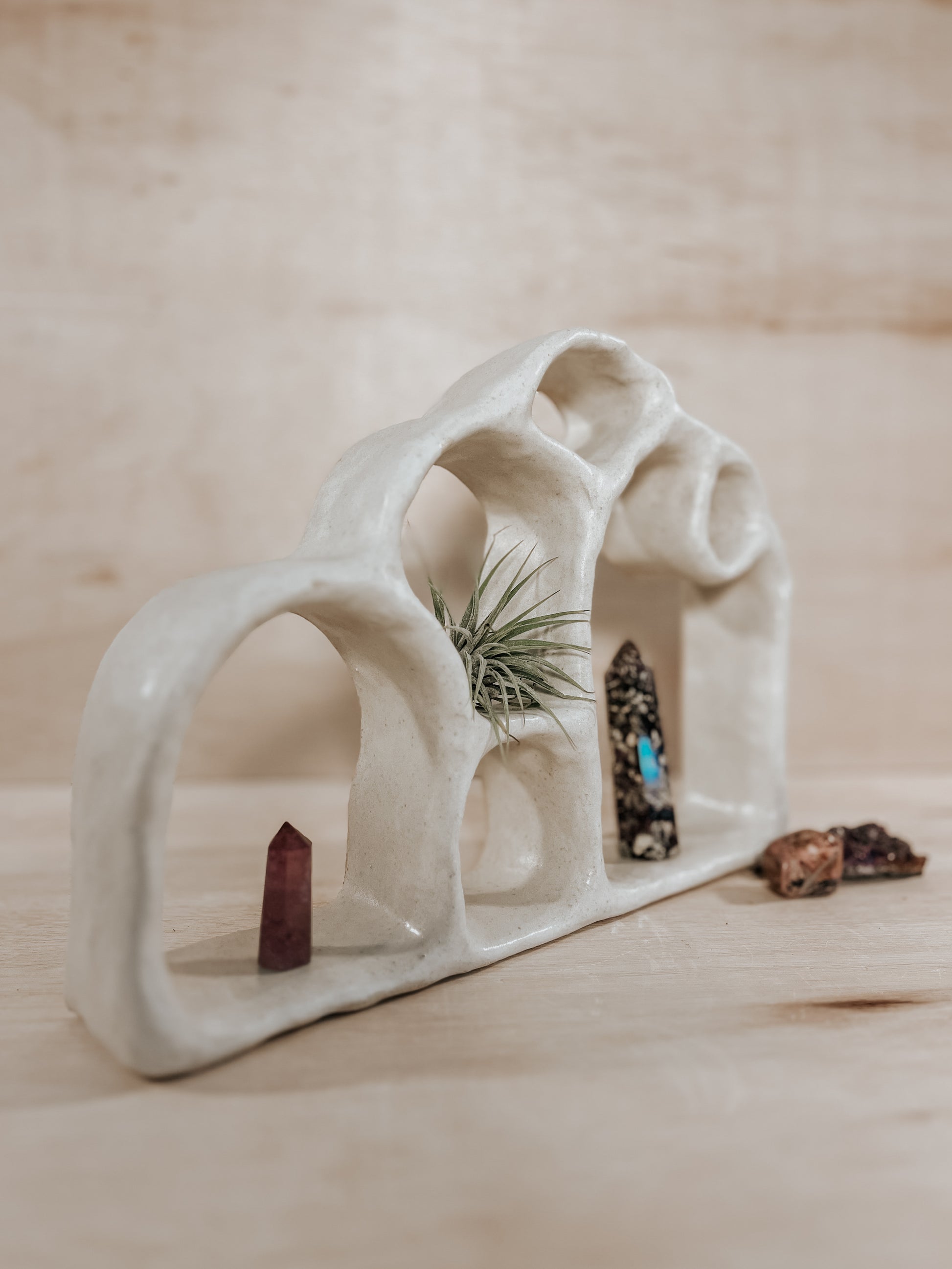 Hand-built ceramic altar with matte glaze, wall-mounted, soft curves, handmade in Boulder