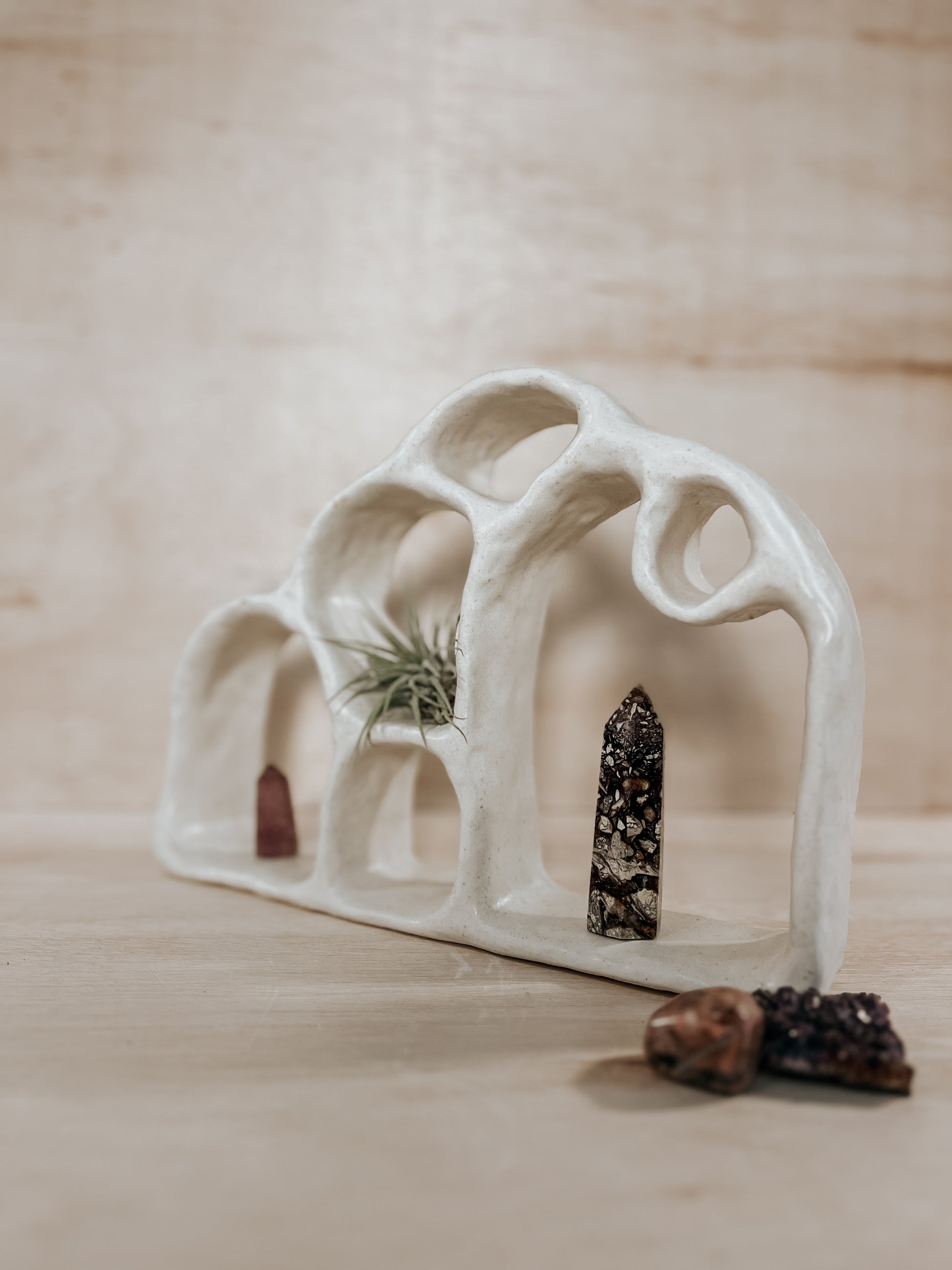 Hand-built ceramic altar with matte glaze, wall-mounted, soft curves, handmade in Boulder